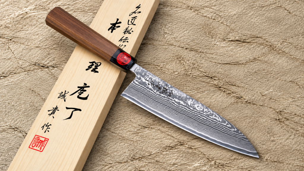 Shigeki Tanaka Japanese Santoku knife with a layered Damascus blade and walnut handle displayed beside a wooden presentation box.