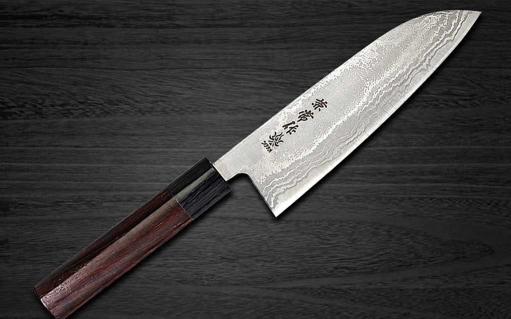 Japanese wa-style santoku knife with a patterned blade and wooden handle on a dark wood background