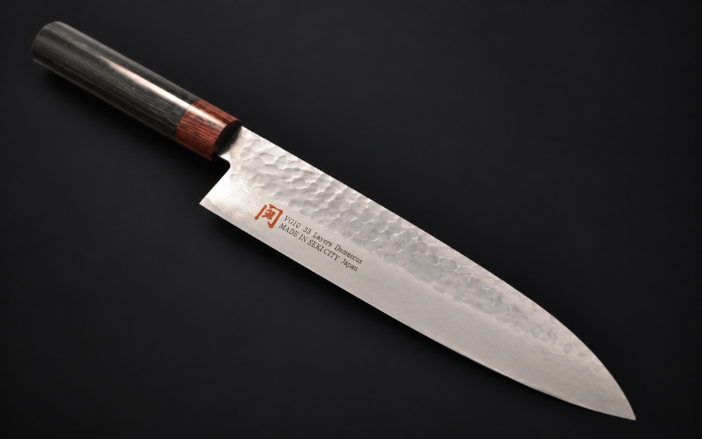 Iseya I-Series VG10 Damascus Santoku 180mm Japanese kitchen knife on a dark background