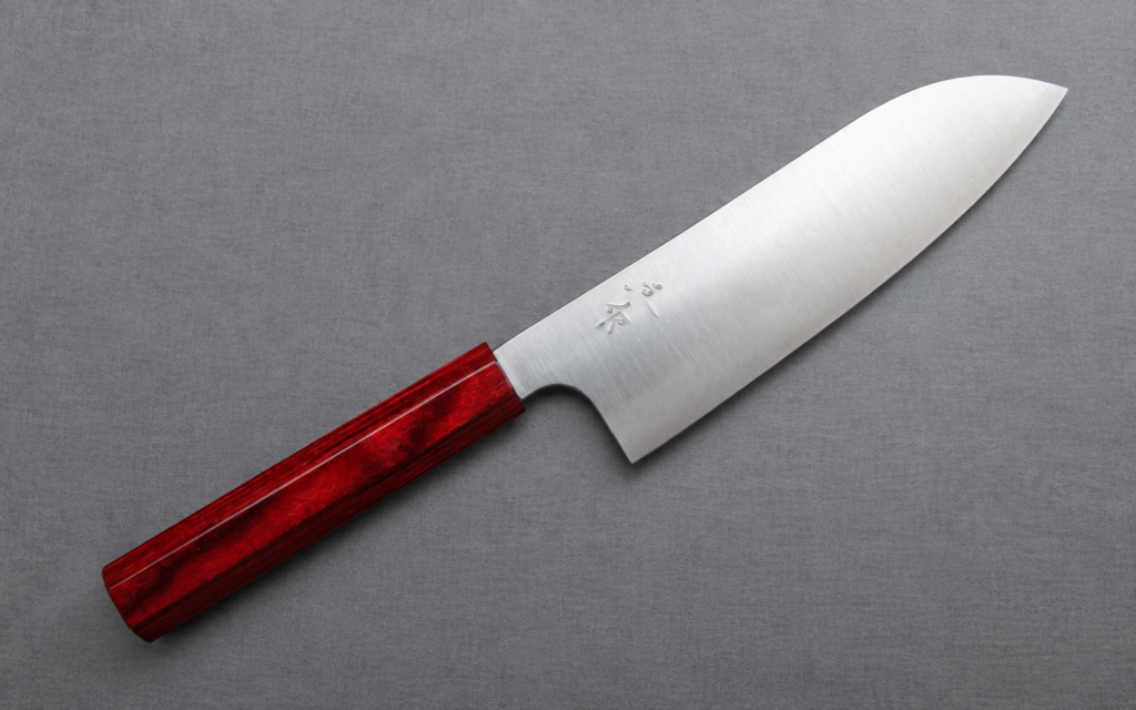 Kei Kobayashi R2 Santoku 170mm Japanese kitchen knife with red lacquered handle on a gray background
