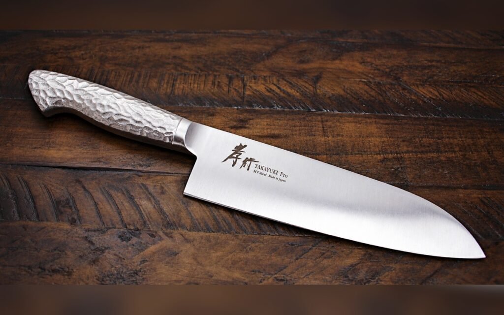 Sakai Takayuki INOX PRO Santoku 180mm Japanese kitchen knife on a dark wooden background